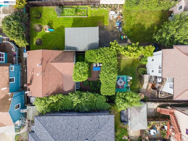 an aerial view of a house with a yard and a fountain
