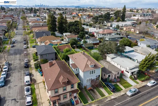 an aerial view of residential houses with outdoor space