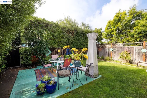a view of a table and chairs in the garden