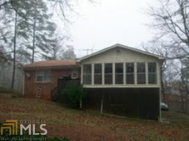614 Huckleberry Road, Unit 58 Canton, GA 30114 - Photo 1 of 1 a front view of a house with a garden