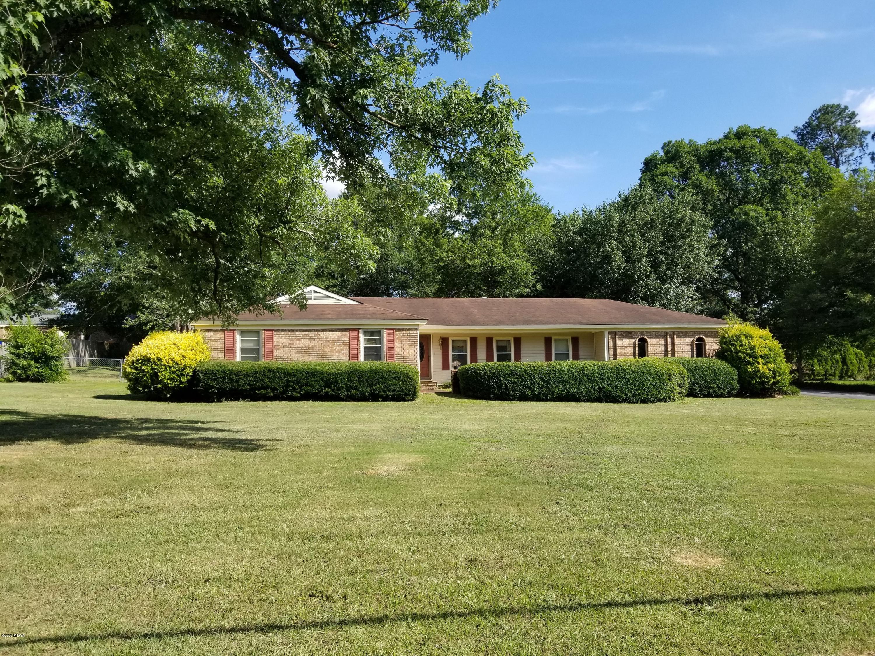 6656 Goodall Mill Road Macon, GA 31216 - Photo 1 of 21 a front view of a house with yard and green space
