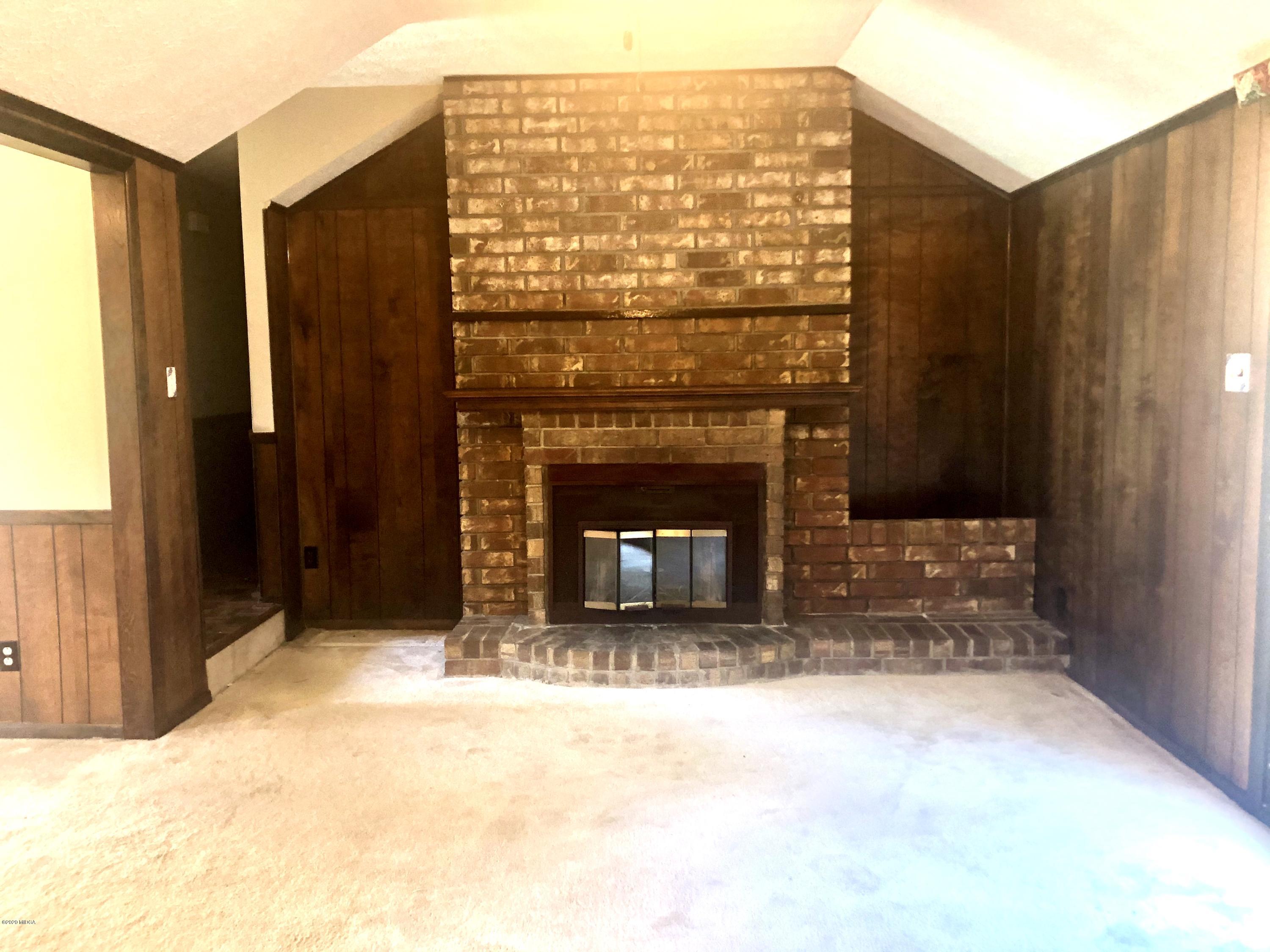6656 Goodall Mill Road Macon, GA 31216 - Photo 12 of 21 a view of an empty room with a fireplace