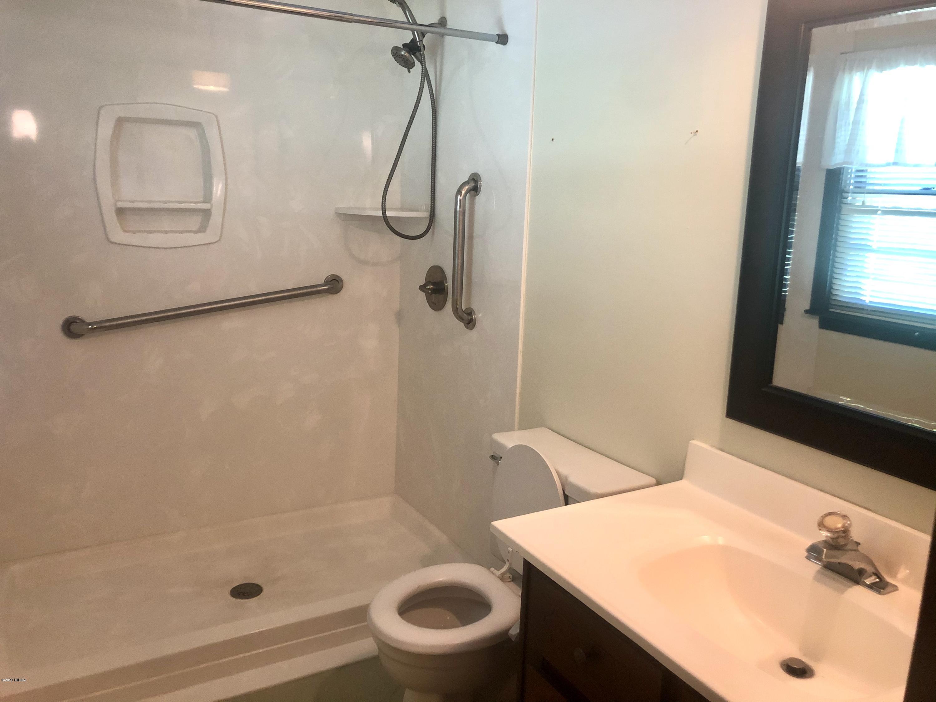 6656 Goodall Mill Road Macon, GA 31216 - Photo 15 of 21 a bathroom with a sink a toilet and shower