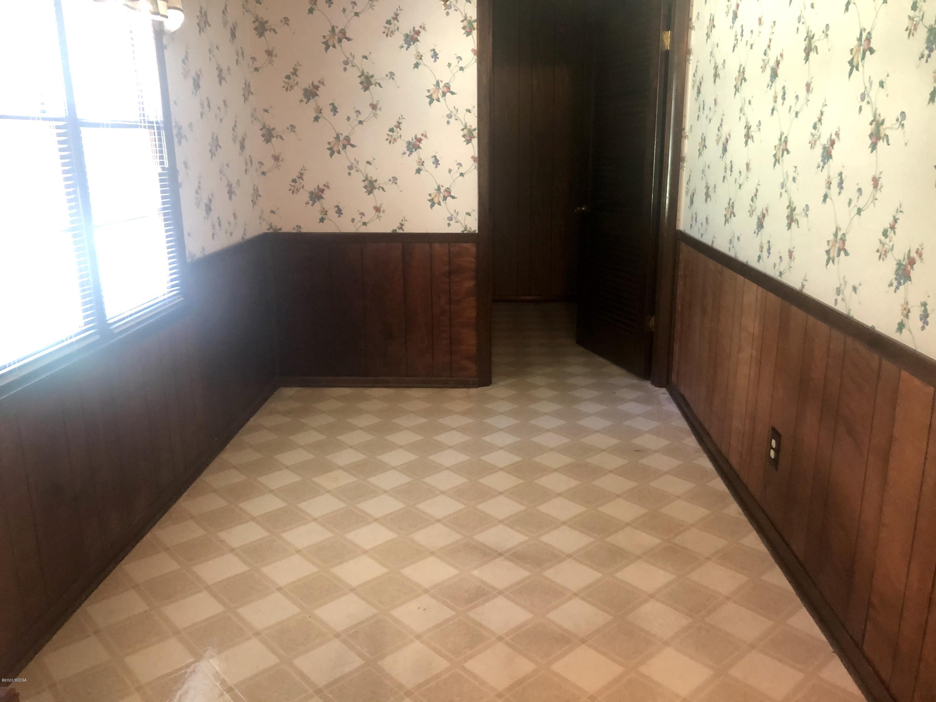 6656 Goodall Mill Road Macon, GA 31216 - Photo 7 of 21 a bedroom with wooden floor and window