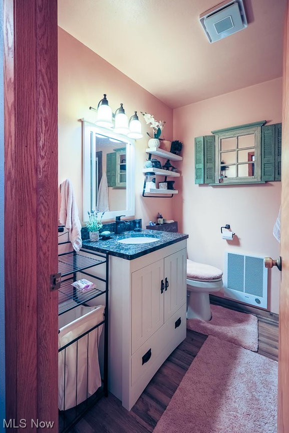 827 Bakers Addition Road Hopedale, OH 43976 - Photo 17 of 34 Bathroom with vanity, hardwood floors, and toilet