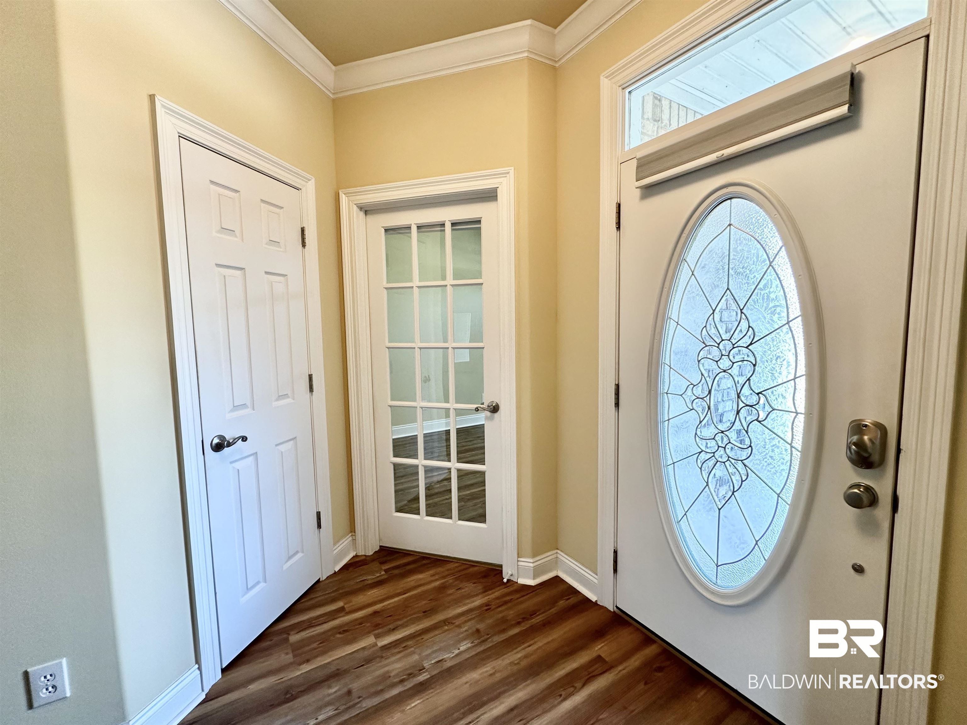249 Hemingway Loop Foley, AL 36535 - Photo 15 of 33 Entrance foyer featuring ornamental molding and dark hardwood / wood-style floors
