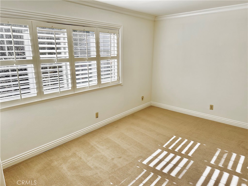 28005-28005 Ridgebluff Court Rancho Palos Verdes, CA 90275 - Photo 17 of 30 a view of a room with wooden floor and a window