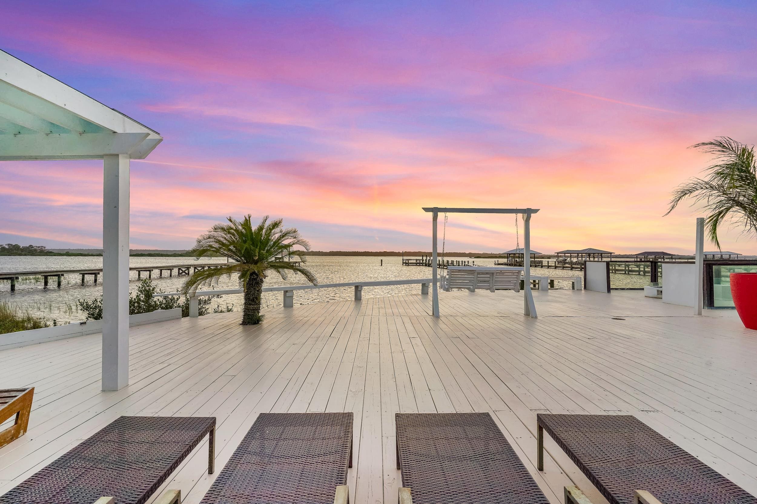 7337 A1A South St. Augustine, FL 32080 - Photo 13 of 100 Deck at dusk featuring a water view