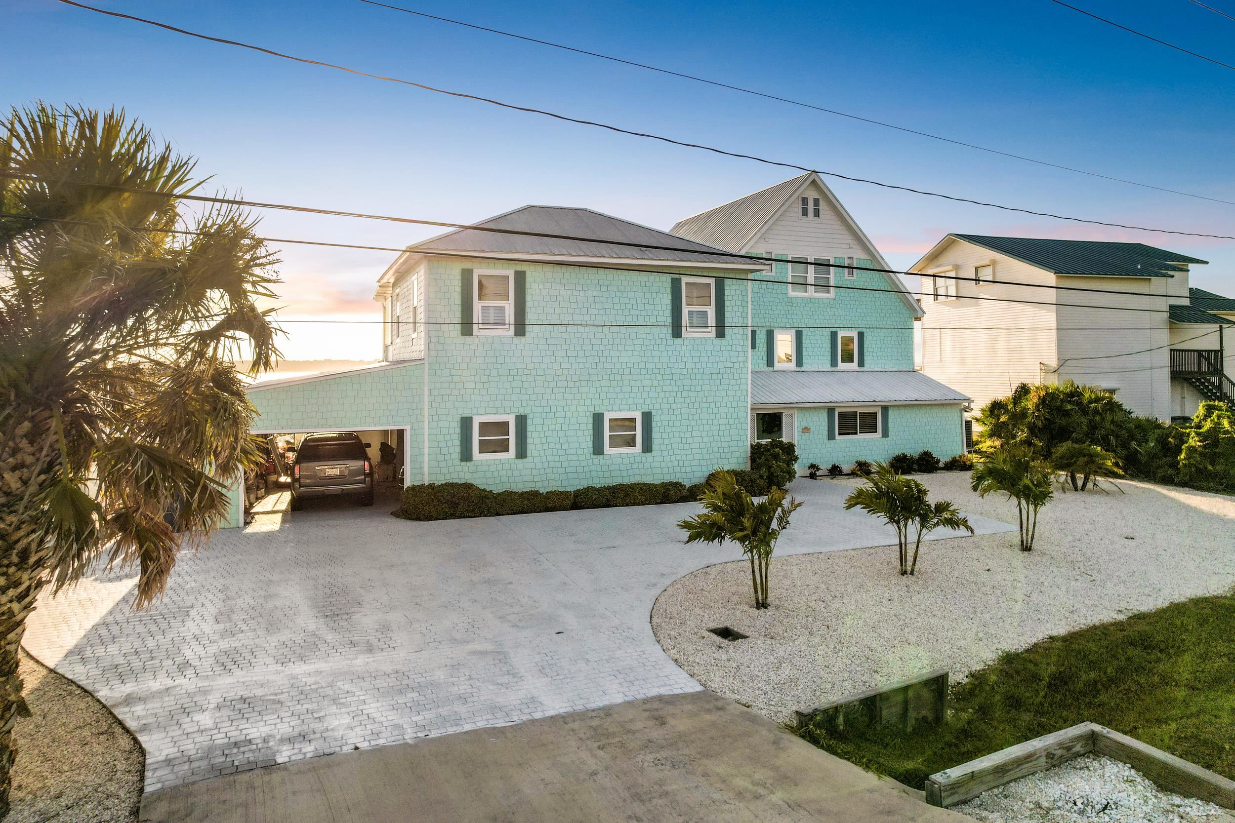 7337 A1A South St. Augustine, FL 32080 - Photo 2 of 100 View of front of house featuring decorative driveway