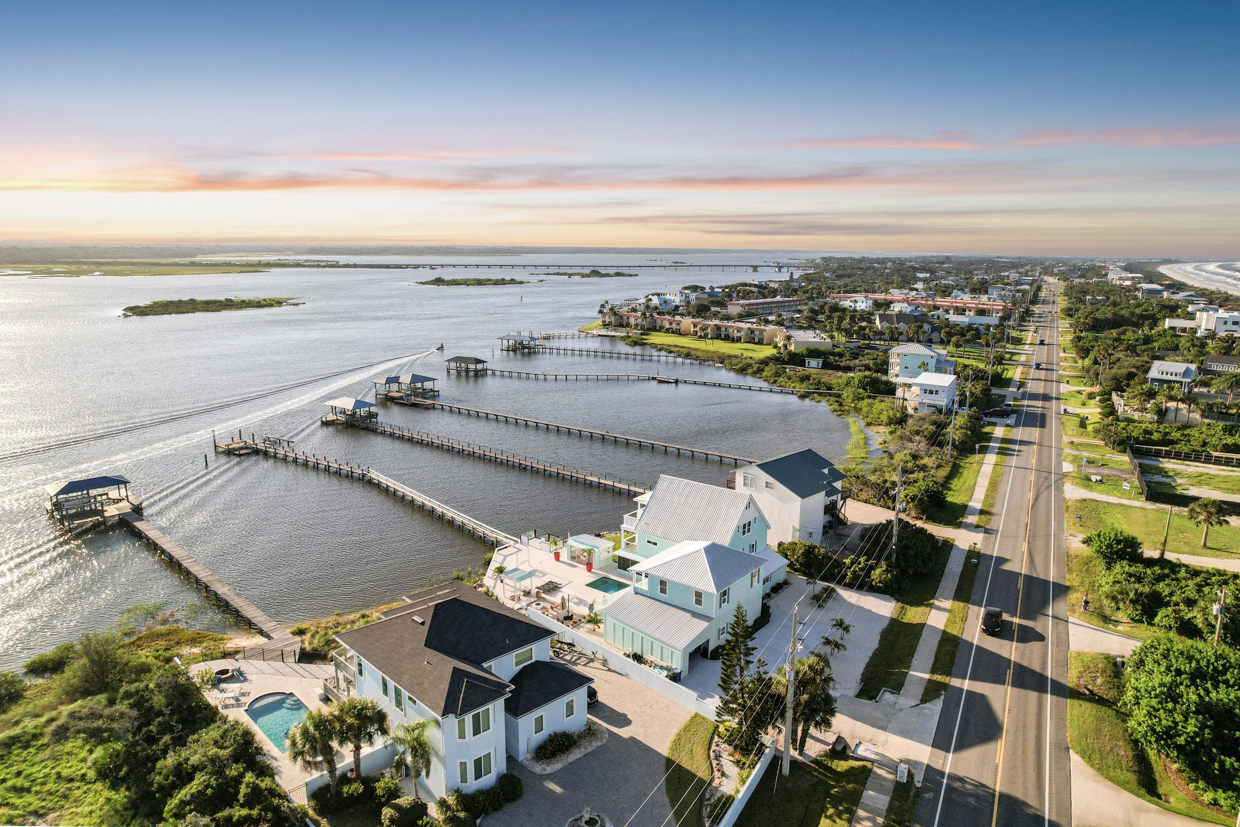 7337 A1A South St. Augustine, FL 32080 - Photo 22 of 100 Aerial view at dusk of a notable bridge, a residential view, and a water view