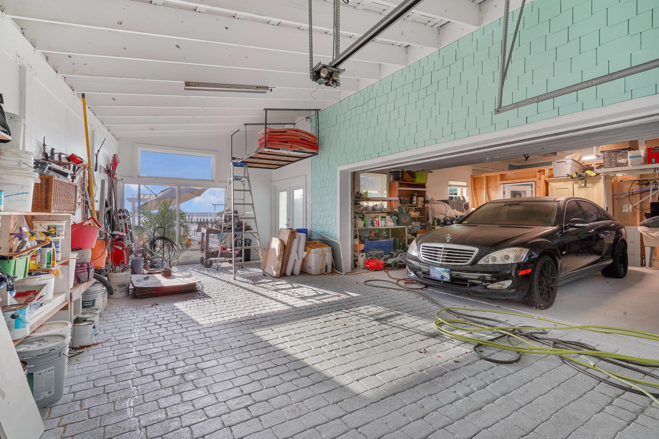 7337 A1A South St. Augustine, FL 32080 - Photo 25 of 100 Garage with a garage door opener and a workshop area