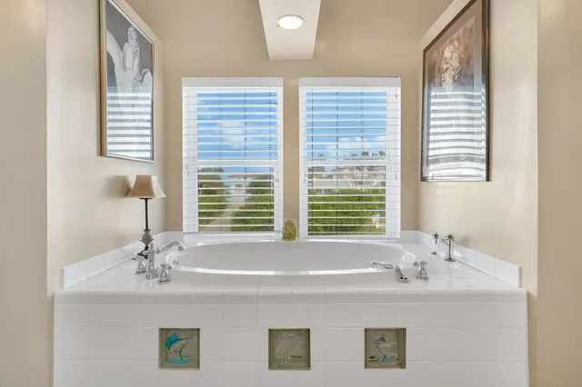a view of a living room with a floor to ceiling window