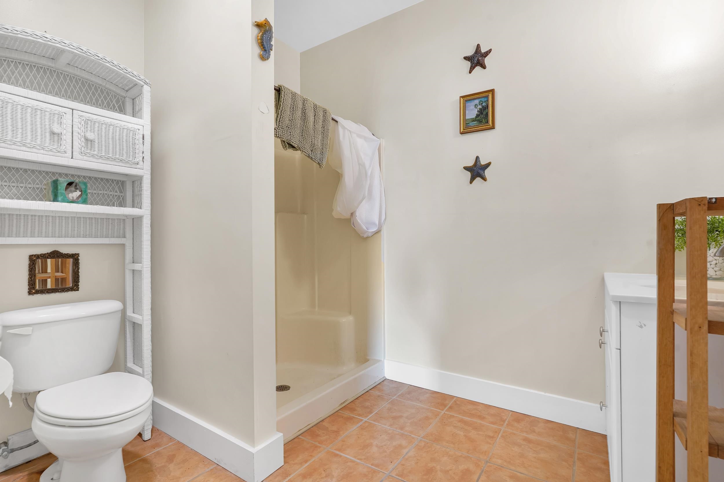7337 A1A South St. Augustine, FL 32080 - Photo 27 of 100 Bathroom featuring light tile patterned floors and a shower stall