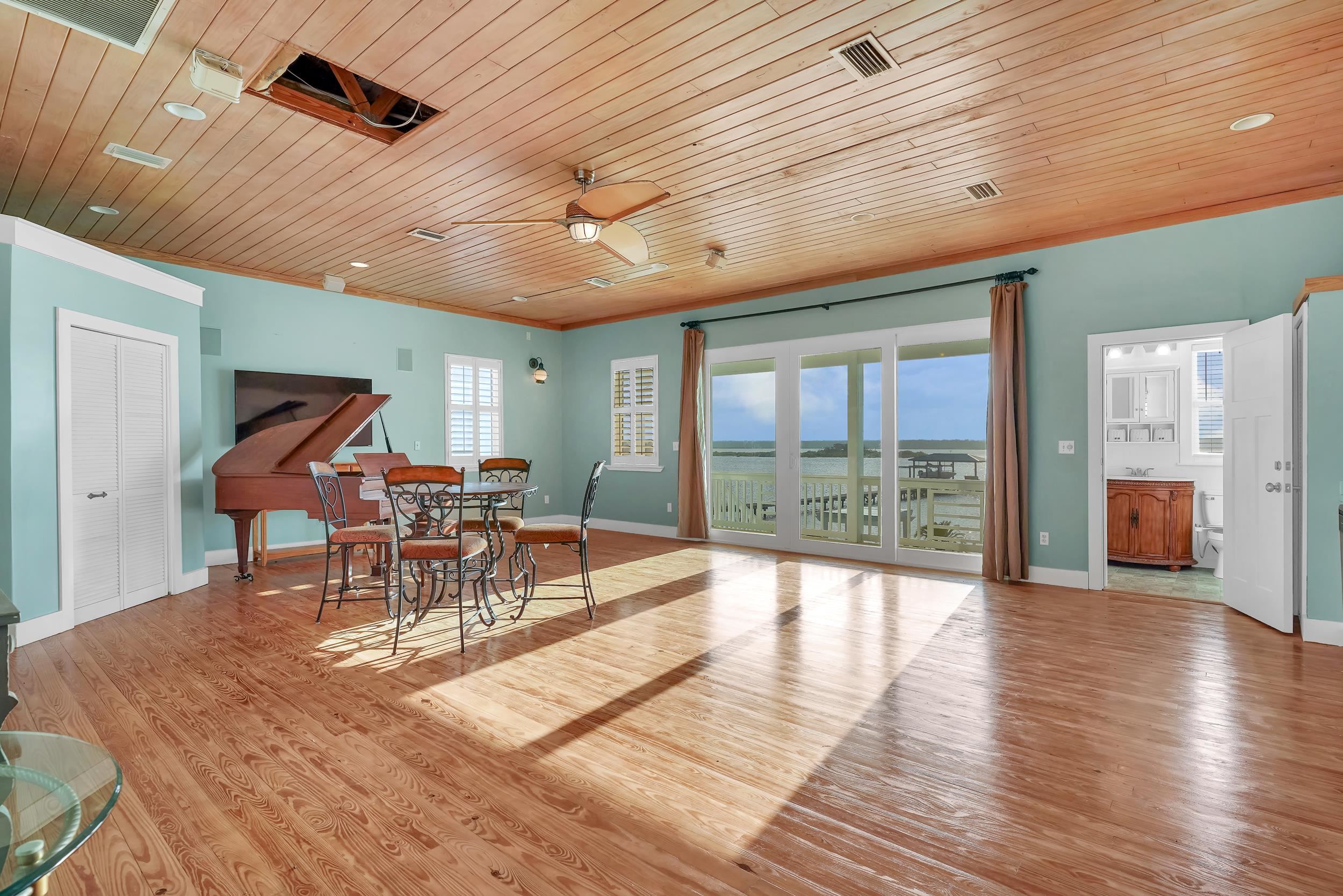 7337 A1A South St. Augustine, FL 32080 - Photo 40 of 100 Dining area with wooden ceiling, ceiling fan, light wood finished floors, and ornamental molding