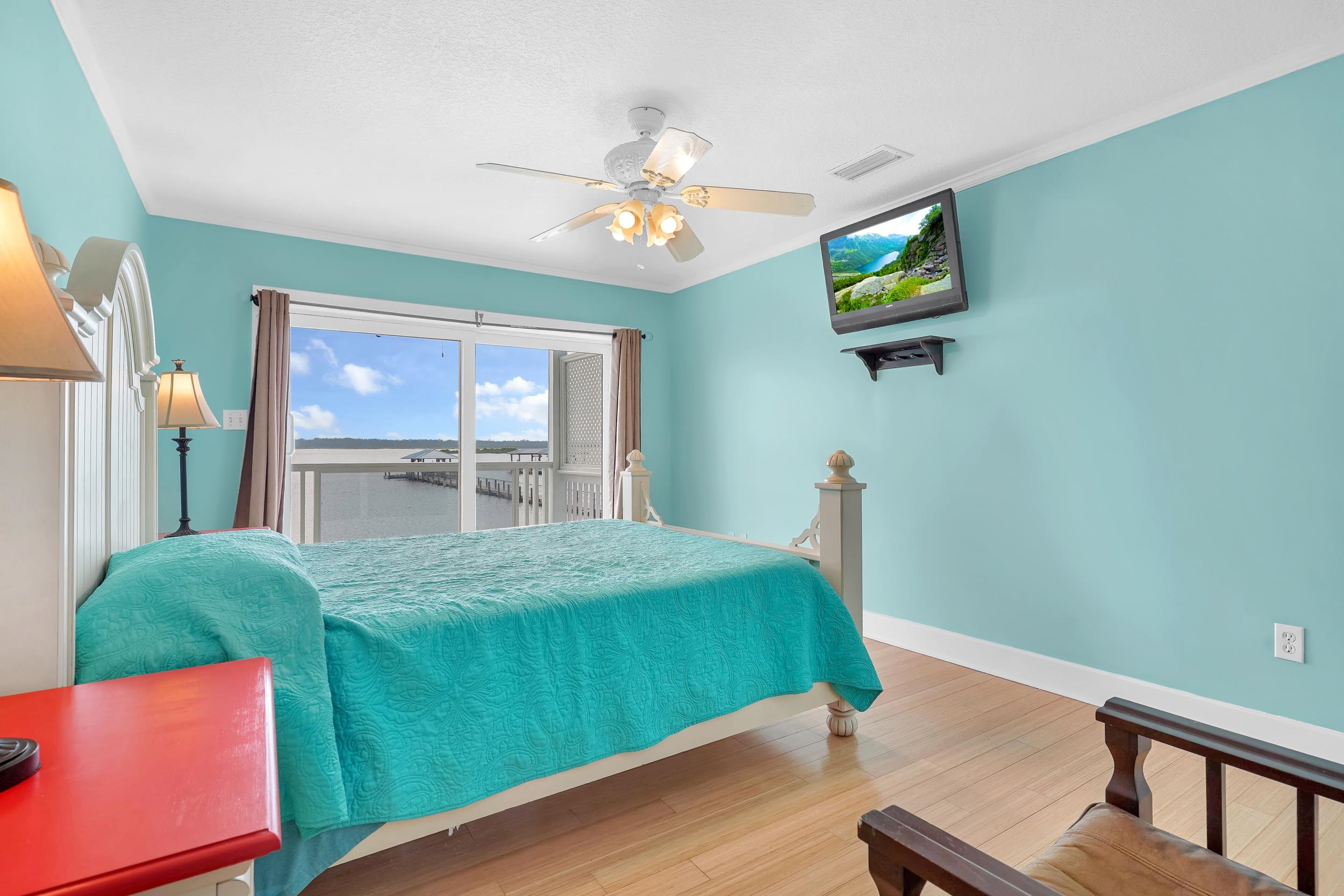 7337 A1A South St. Augustine, FL 32080 - Photo 42 of 100 Bedroom with light wood-style floors, ceiling fan, and access to outside