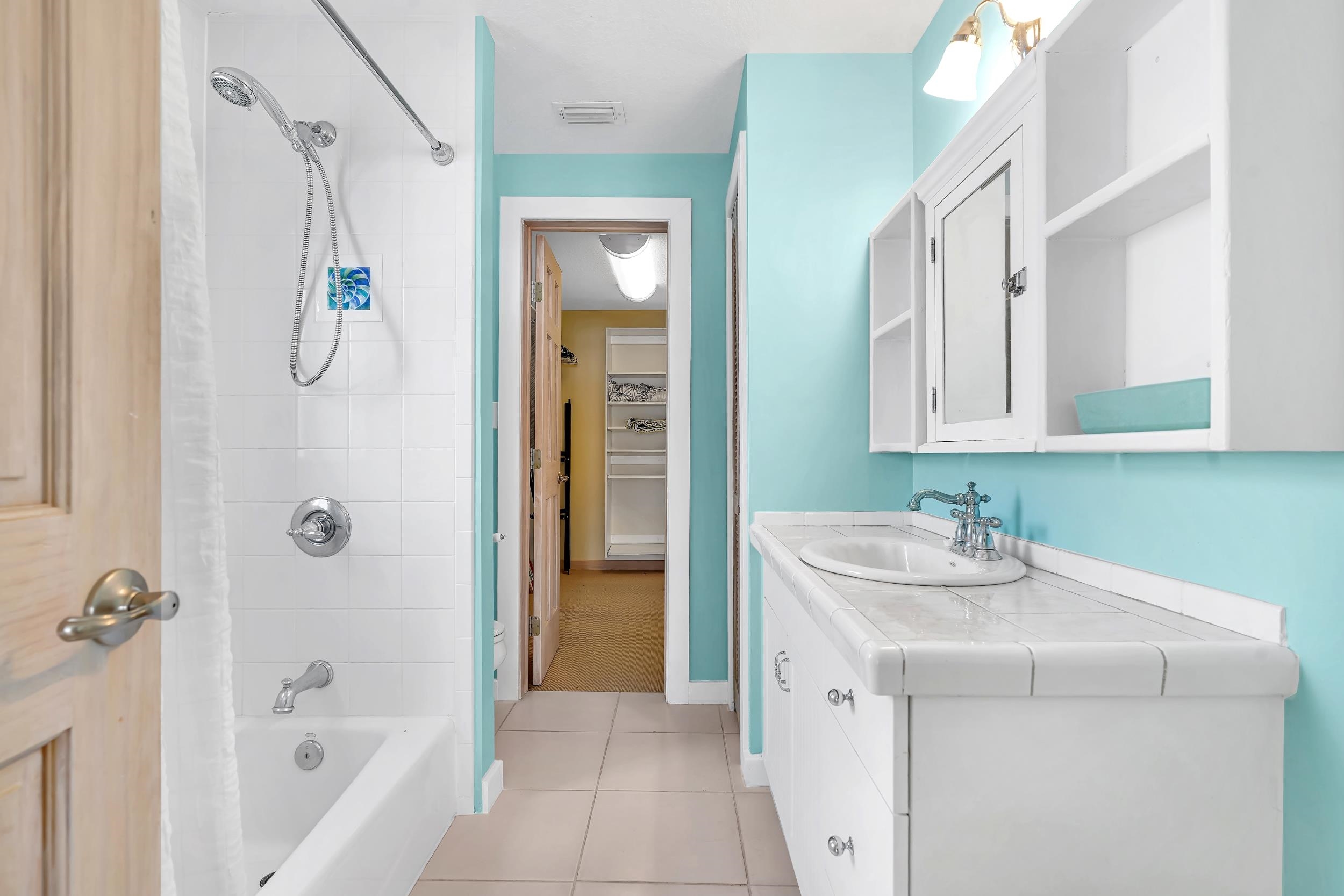 7337 A1A South St. Augustine, FL 32080 - Photo 45 of 100 Bathroom featuring shower / bath combo, vanity, light tile patterned floors, and a closet
