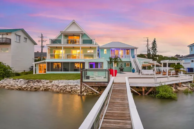a view of entryway with wooden floor and stairs