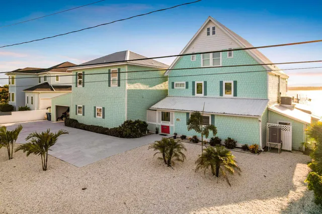 a spacious bedroom with a large bed and a large window