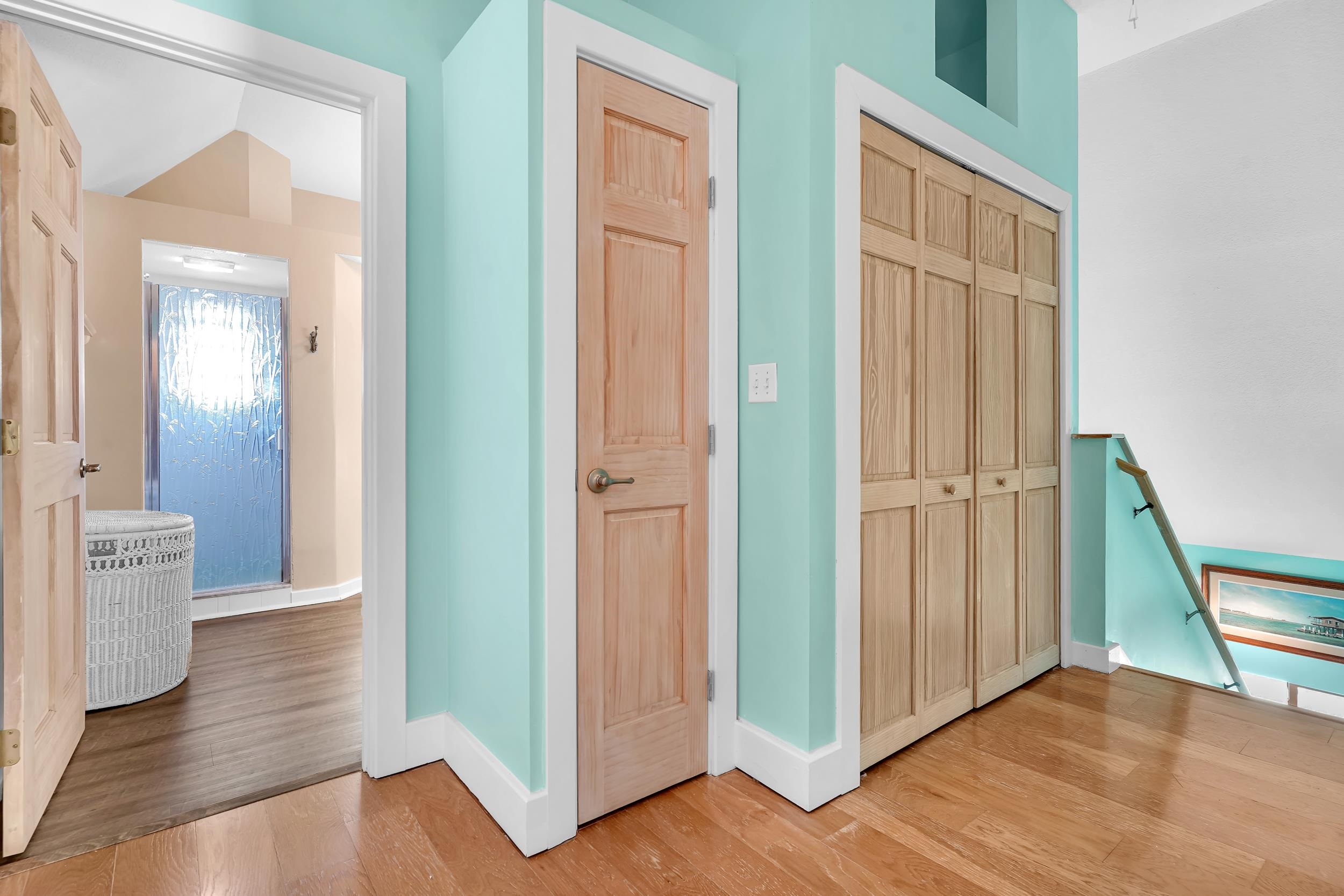 7337 A1A South St. Augustine, FL 32080 - Photo 60 of 100 Hallway with an upstairs landing, light wood-style floors, and vaulted ceiling