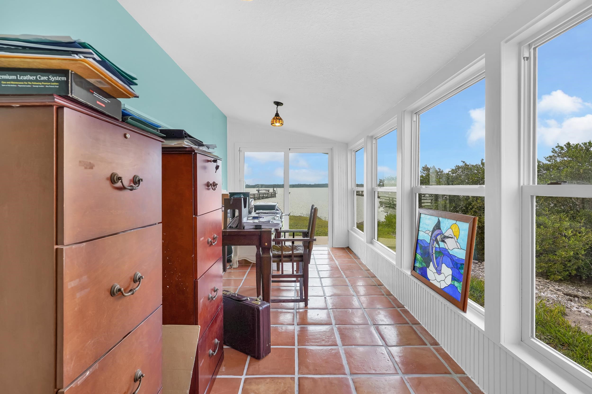 7337 A1A South St. Augustine, FL 32080 - Photo 69 of 100 Sunroom featuring vaulted ceiling and tile patterned flooring