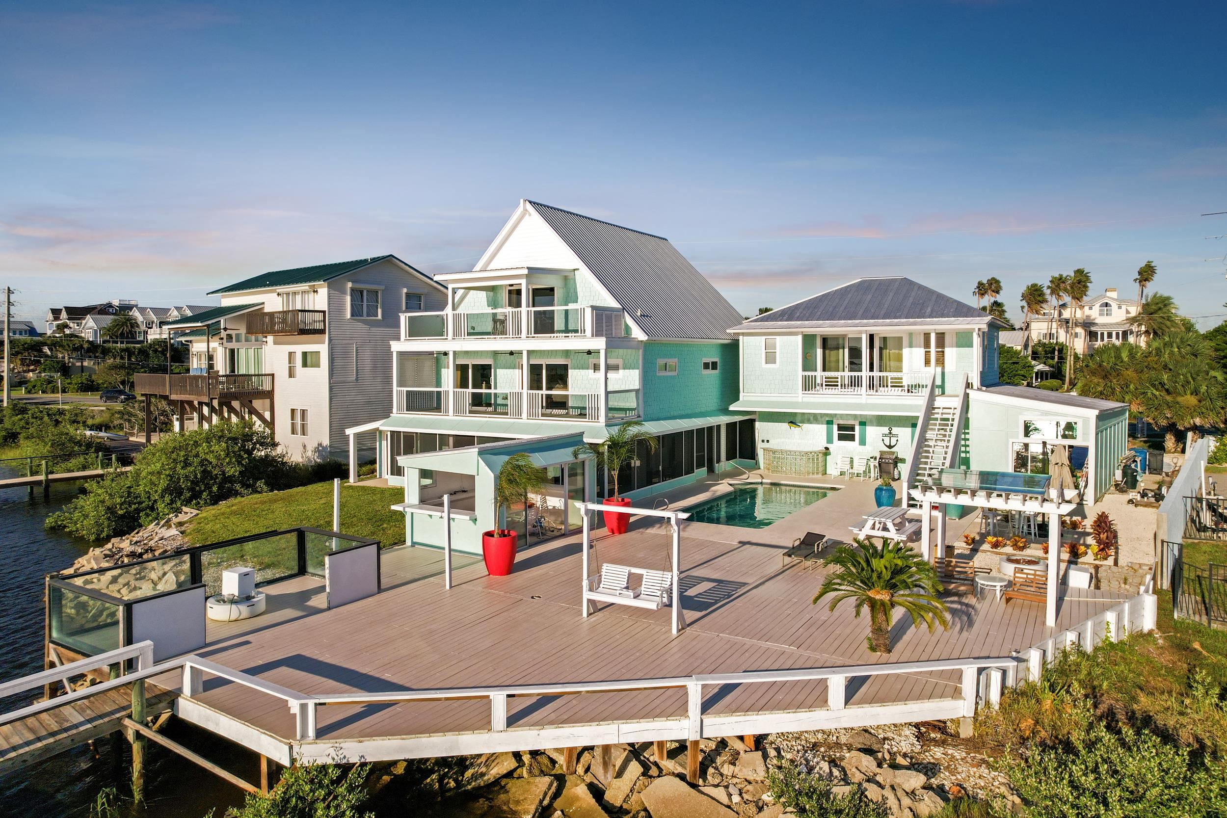 7337 A1A South St. Augustine, FL 32080 - Photo 7 of 100 Back of property with a deck with water view, a jacuzzi, a patio area, outdoor dining space, and a balcony