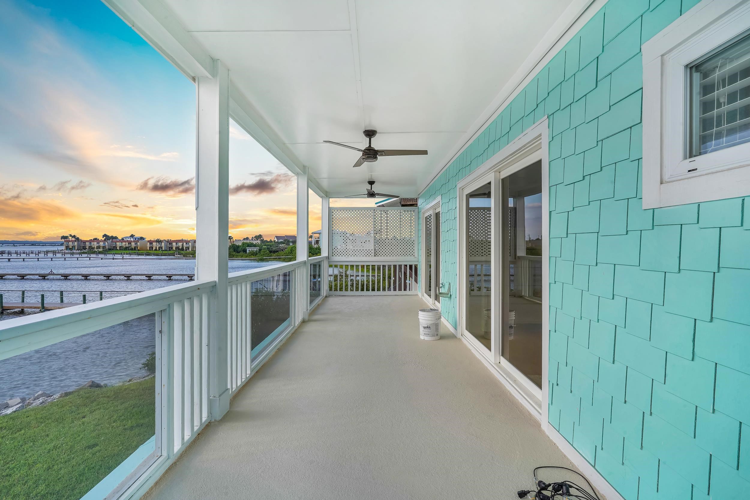 7337 A1A South St. Augustine, FL 32080 - Photo 81 of 100 Balcony at dusk featuring a ceiling fan
