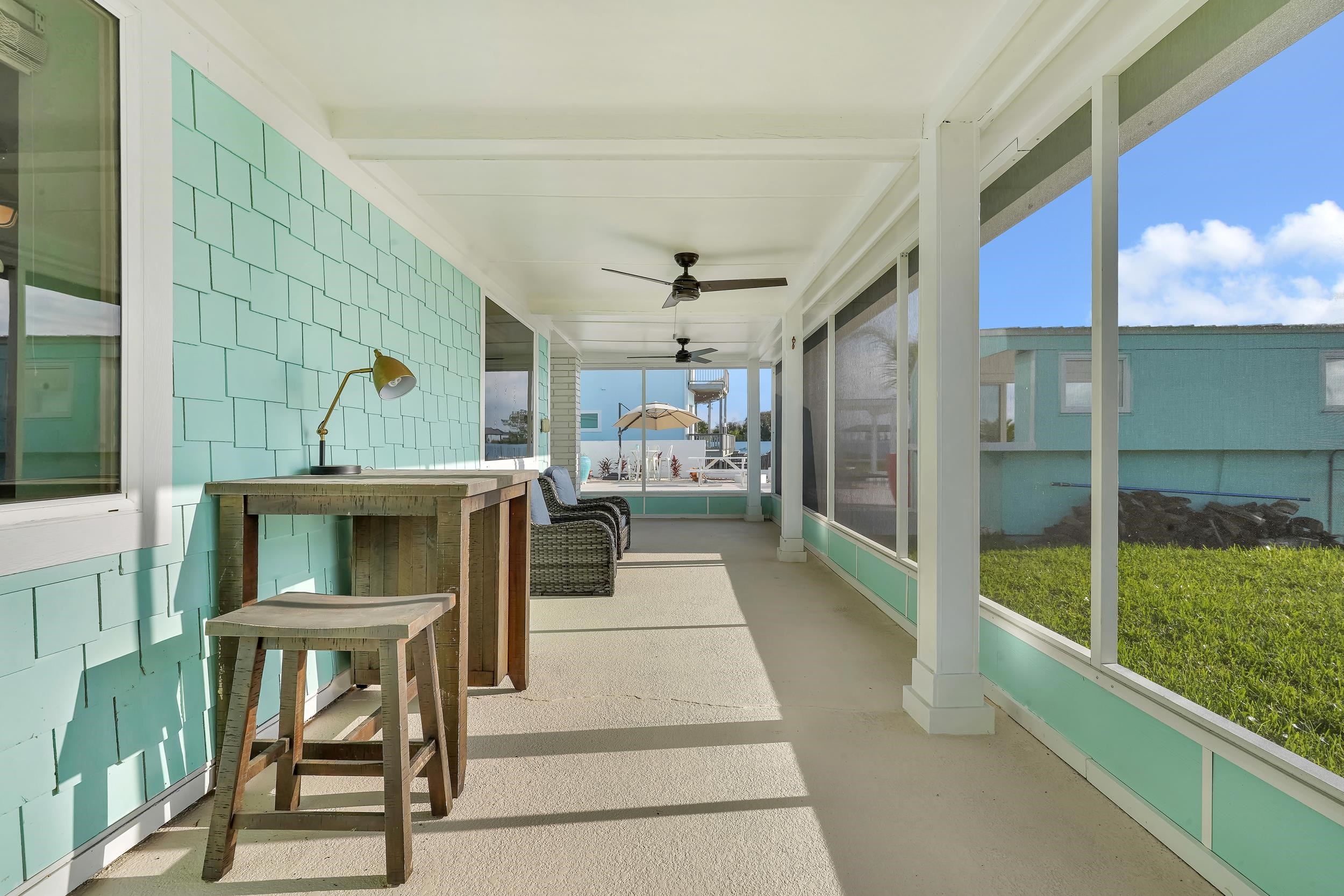 7337 A1A South St. Augustine, FL 32080 - Photo 86 of 100 Back Porch with ceiling fan and beamed ceiling