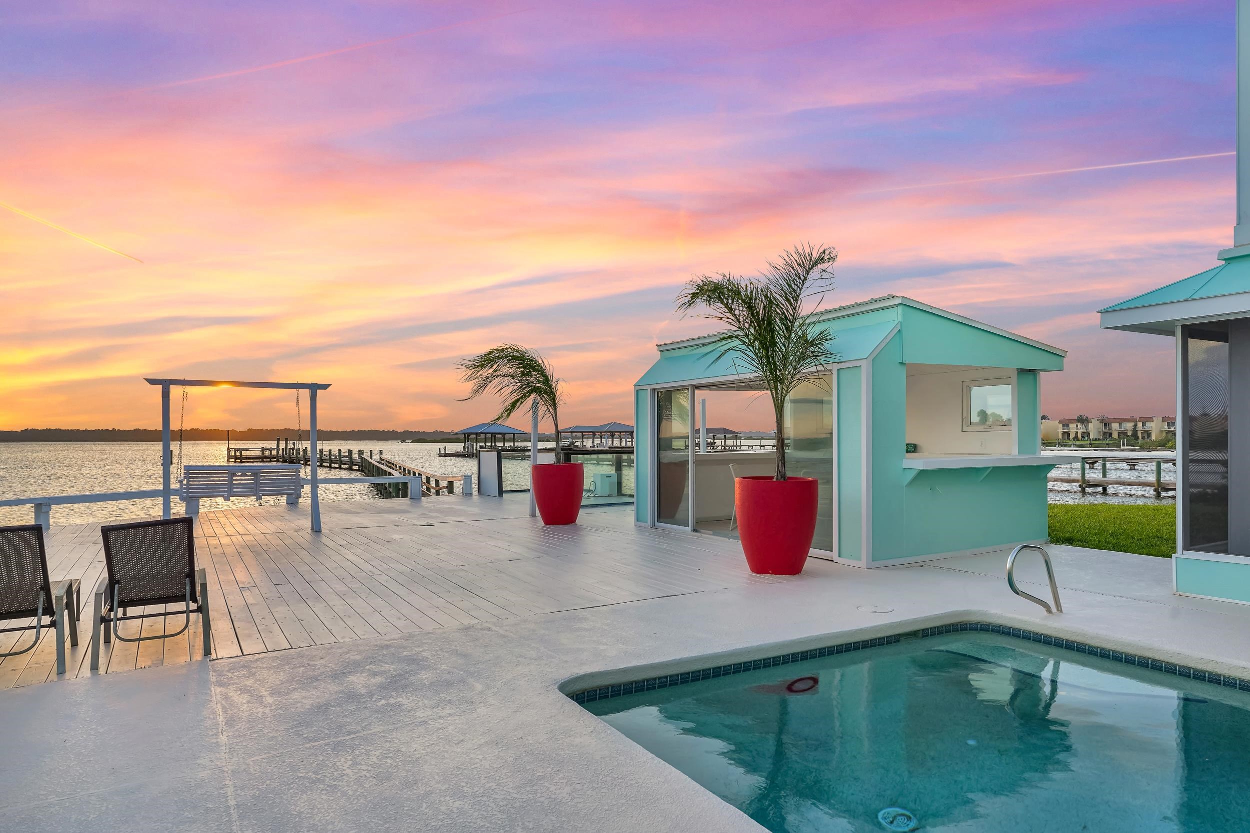 7337 A1A South St. Augustine, FL 32080 - Photo 90 of 100 Pool at dusk with a water view and an outdoor pool