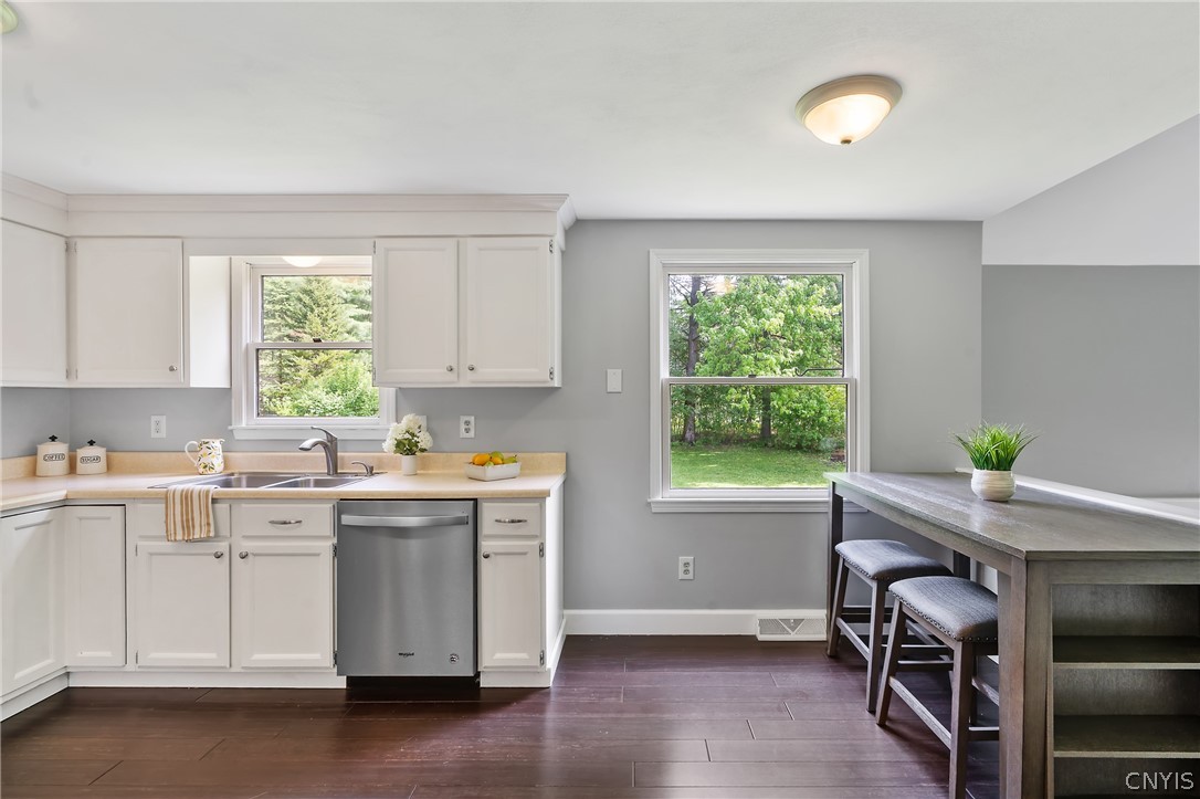8841 Wandering Way Lysander, NY 13027 - Photo 15 of 42 Kitchen overlooks private back yard.