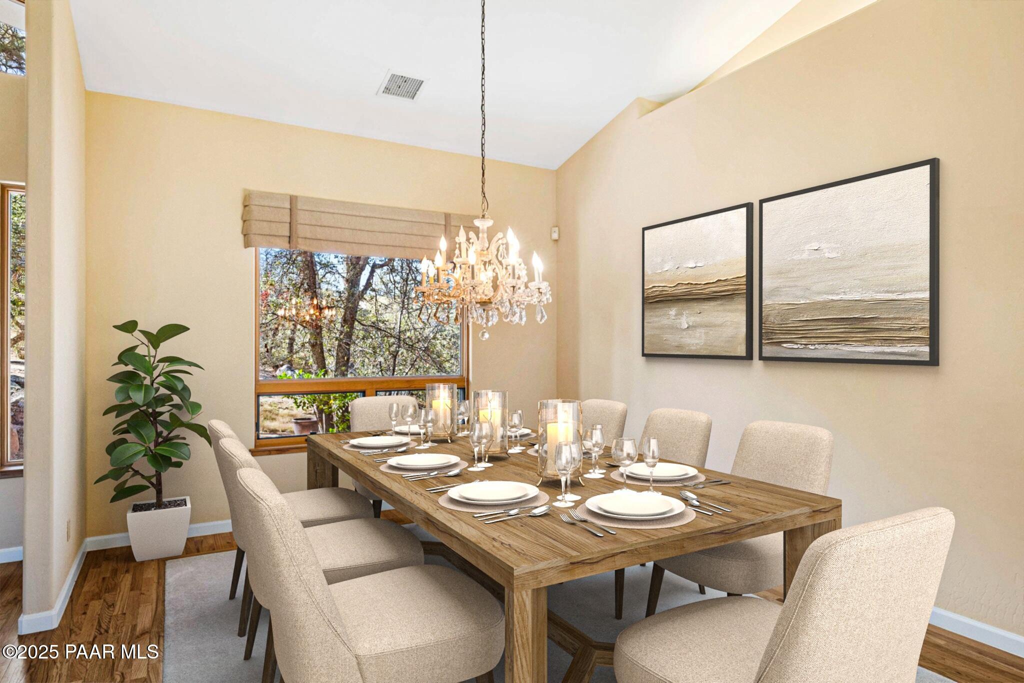 1741 Conifer Ridge Lane Prescott, AZ 86303 - Photo 11 of 78 a dining room with furniture a large window and potted plants
