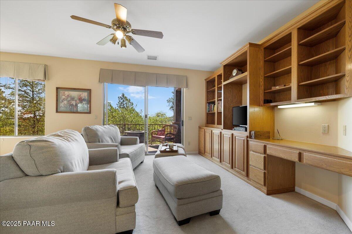 1741 Conifer Ridge Lane Prescott, AZ 86303 - Photo 32 of 78 a living room with furniture a large window with kitchen view