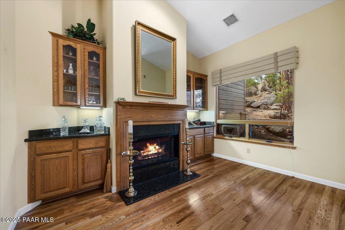 1741 Conifer Ridge Lane Prescott, AZ 86303 - Photo 10 of 78 a living room with wooden floor and a fireplace