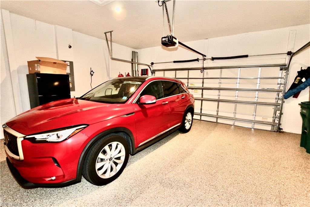 8337 Promoso Court Naples, FL 34114 - Photo 29 of 48 a view of a car in garage