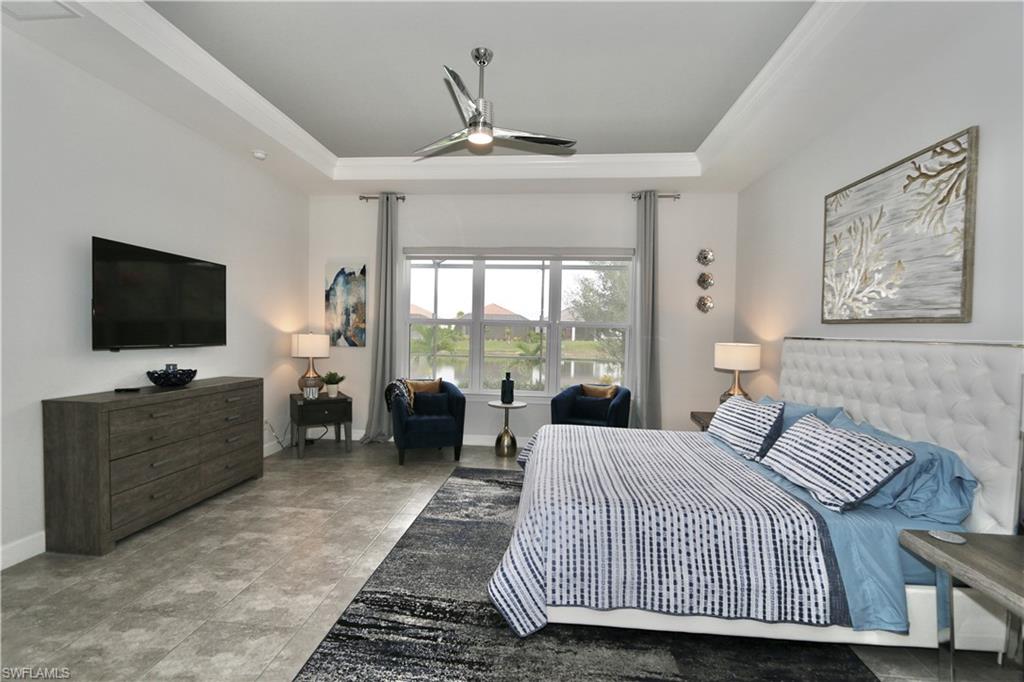 8337 Promoso Court Naples, FL 34114 - Photo 6 of 48 a bedroom with a bed and glass door