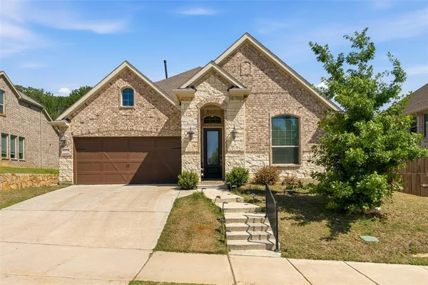 a front view of a house with yard