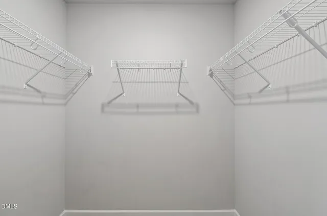 a bathroom with a sink toilet a mirror and shower