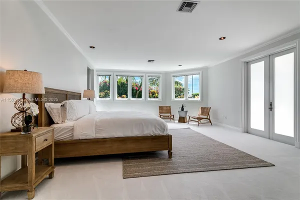 a living room with fireplace furniture and a chandelier