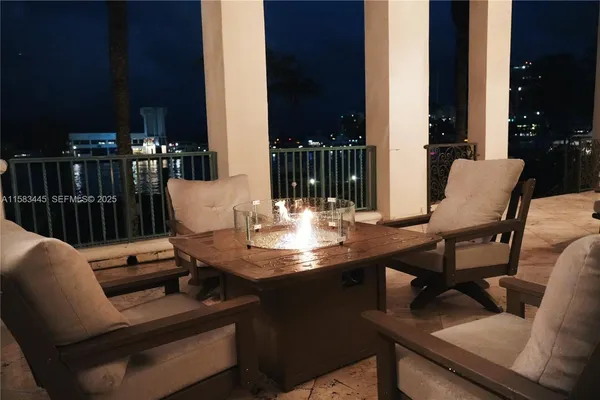 a view of a patio with table and chairs