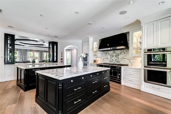 a kitchen with a stove and a microwave