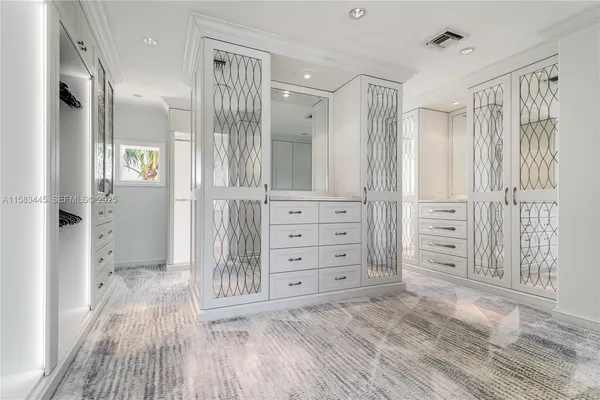 a bathroom with a double vanity sink and mirror