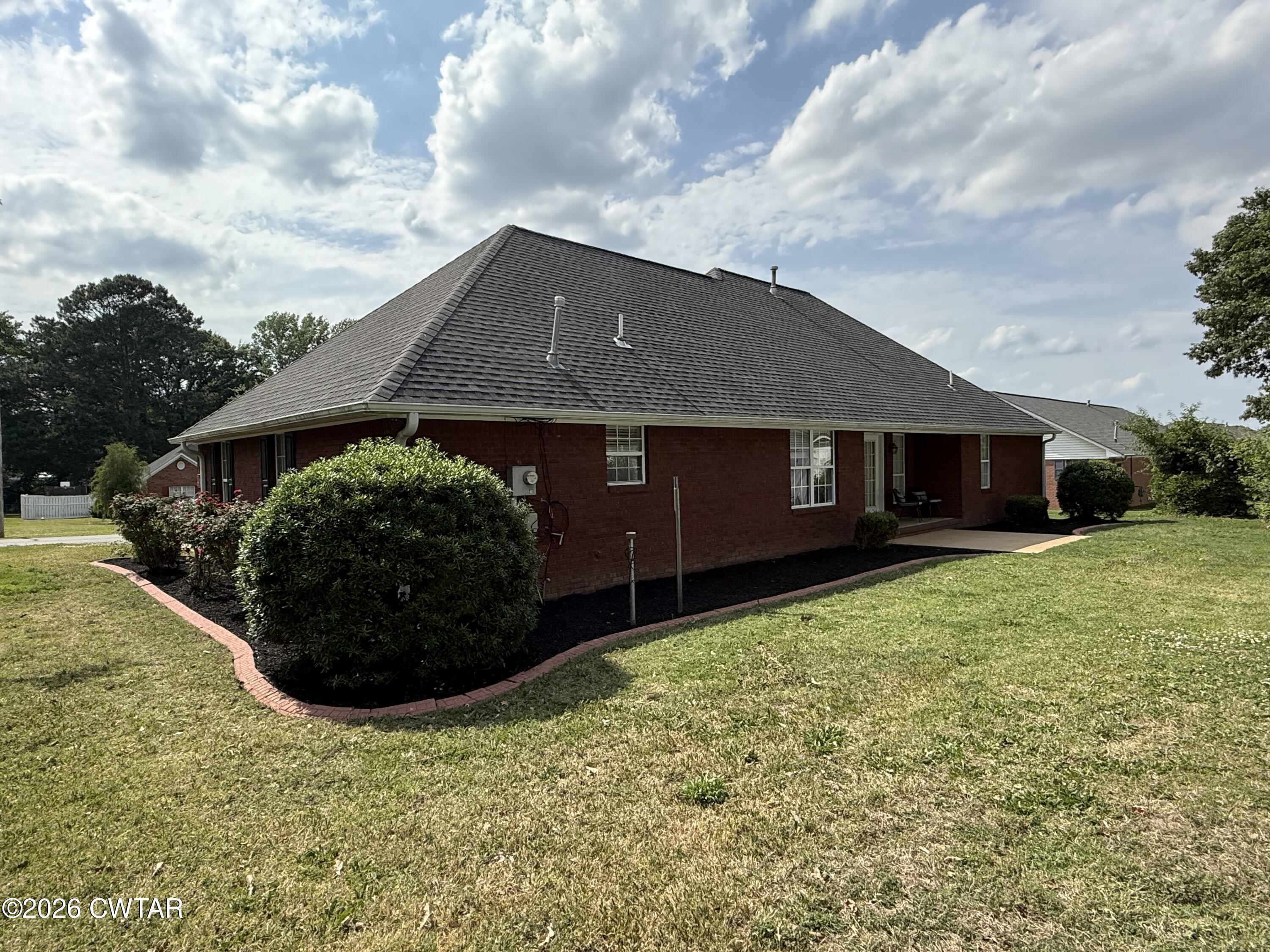 126 Waldunn Cove Rutherford, TN 38369 - Photo 16 of 18 a view of a house with a yard