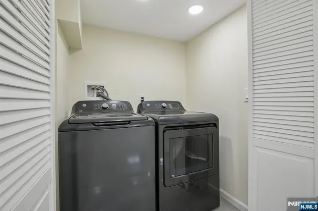 a utility room with washer and dryer