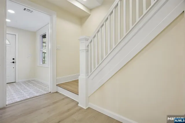 a view of entryway with stairs