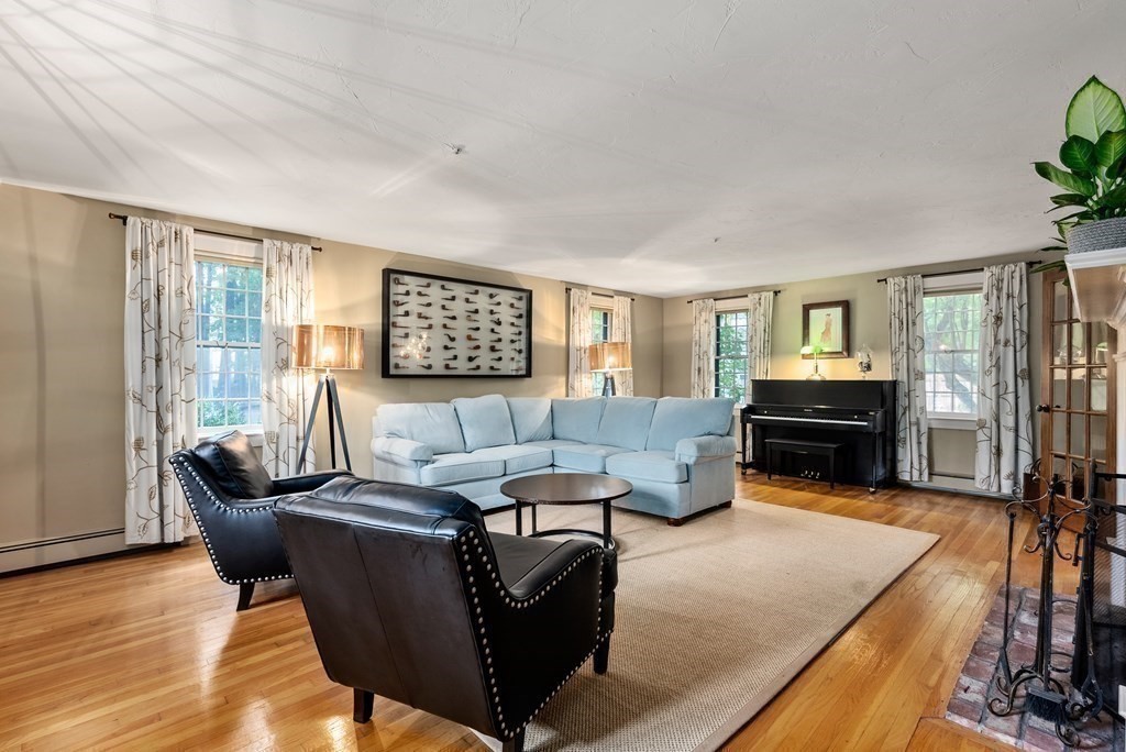 6 Highland Road Acton, MA 01720 - Photo 11 of 35 a living room with furniture and a flat screen tv