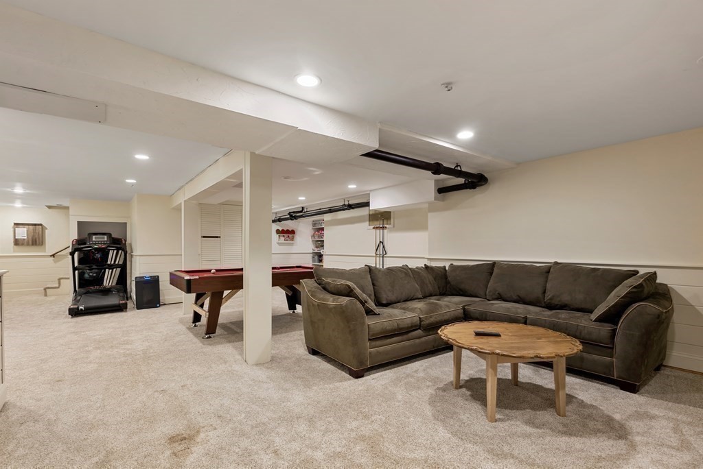 6 Highland Road Acton, MA 01720 - Photo 25 of 35 a projector room with furniture and a couch