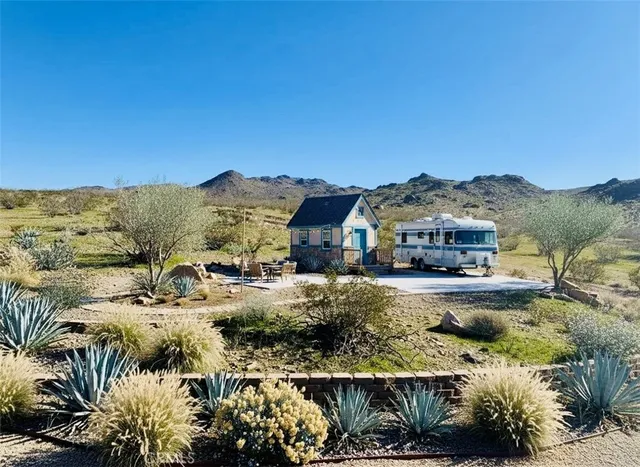a view of a town with mountains in the background