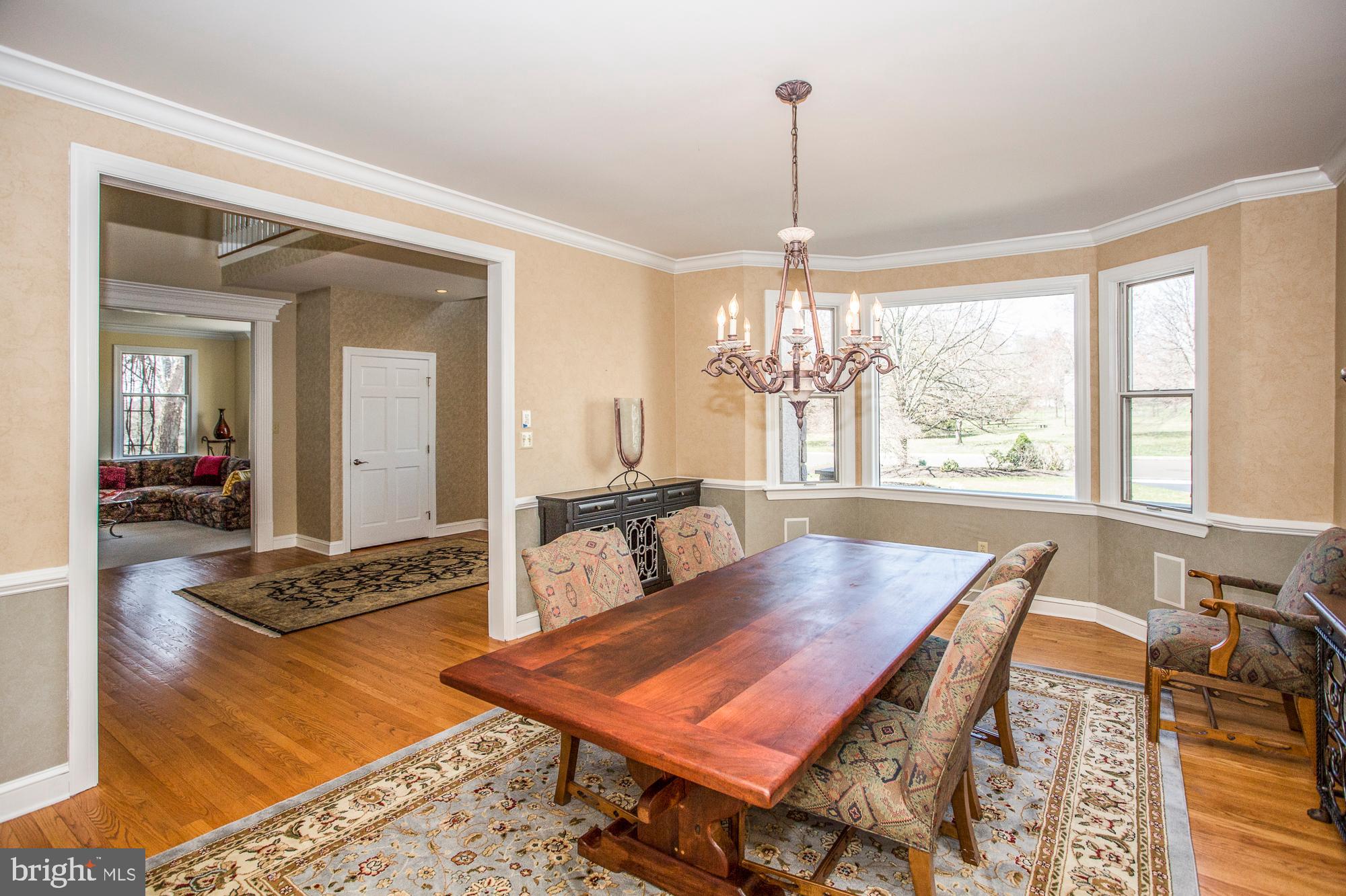 2565 Cold Spring Road Lansdale, PA 19446 - Photo 14 of 61 a living room with furniture a table and a chandelier