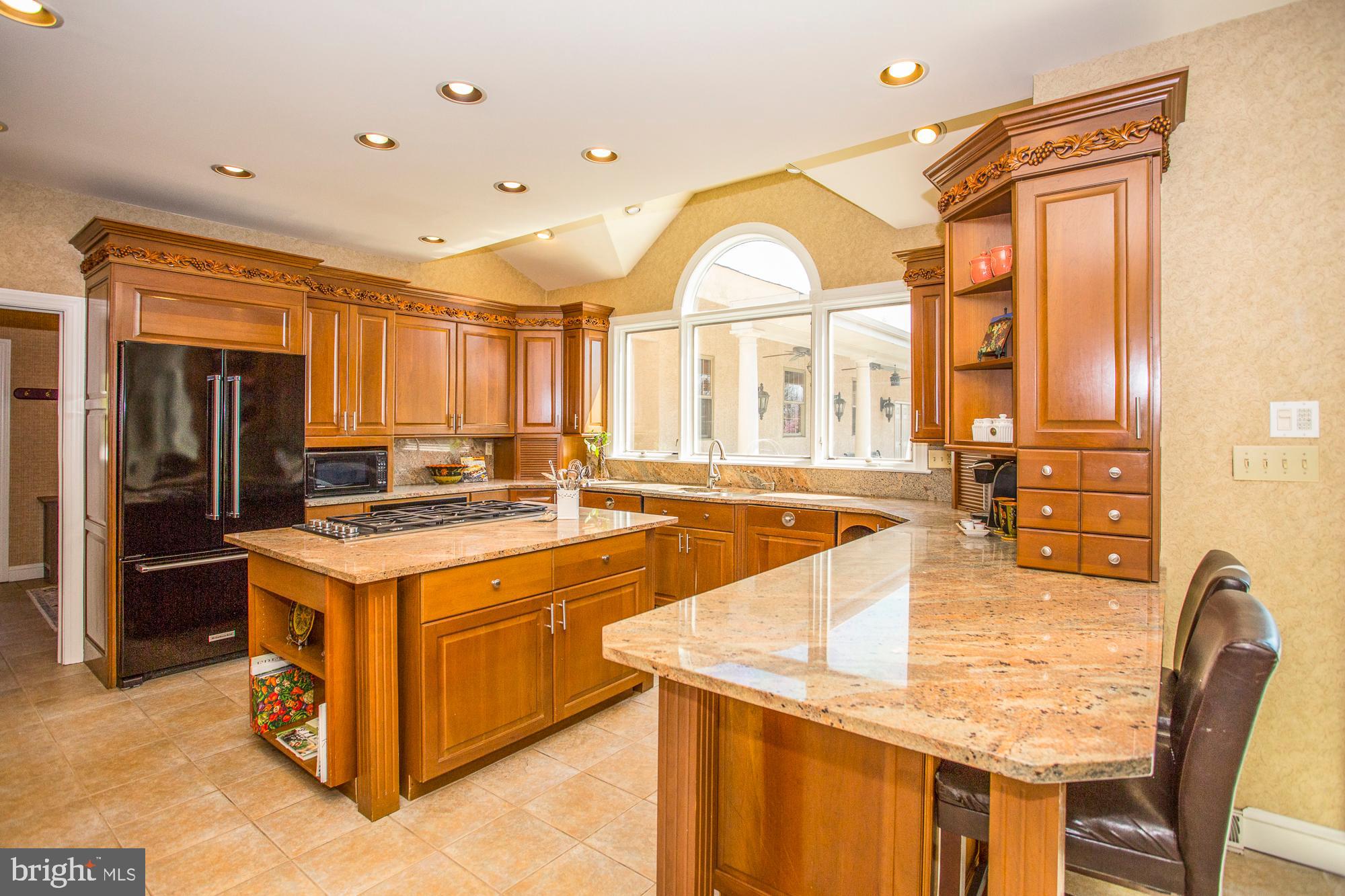 2565 Cold Spring Road Lansdale, PA 19446 - Photo 16 of 61 a kitchen with a stove a refrigerator and a dining table view