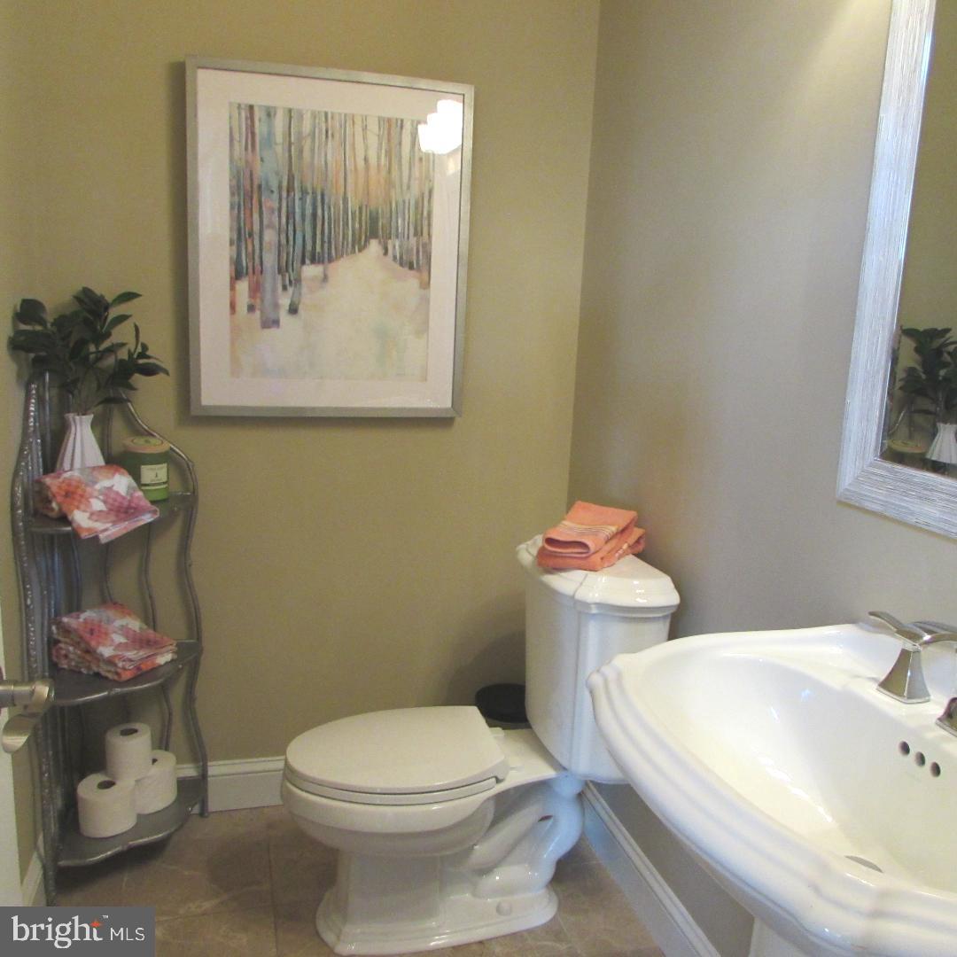 2565 Cold Spring Road Lansdale, PA 19446 - Photo 25 of 61 a white toilet sitting next to a bathroom sink