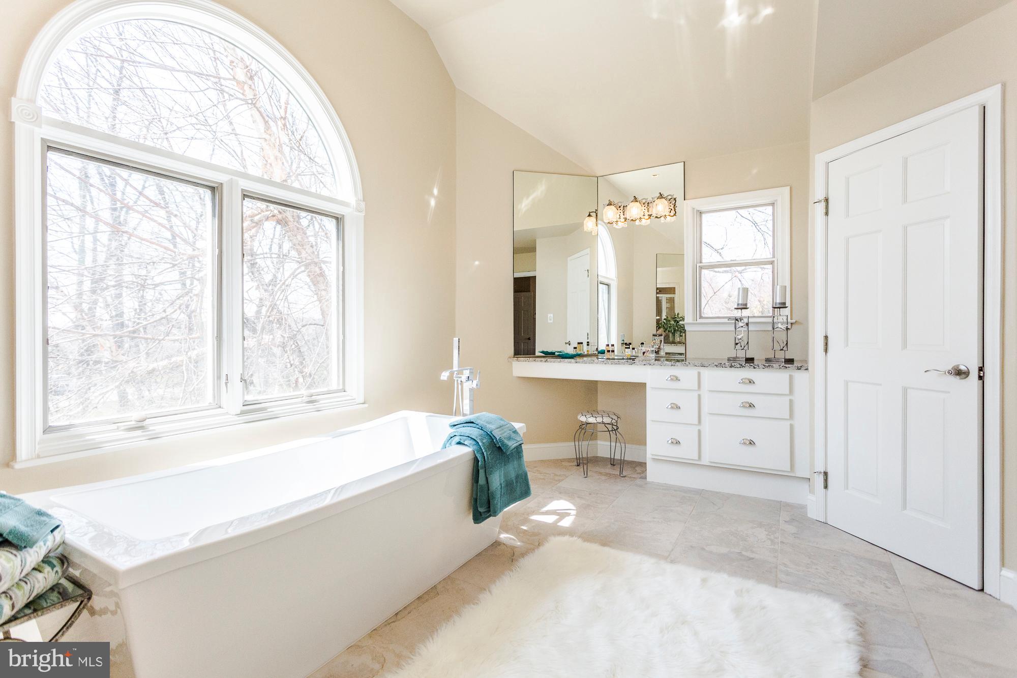 2565 Cold Spring Road Lansdale, PA 19446 - Photo 32 of 61 a spacious bathroom with a tub sink and mirror